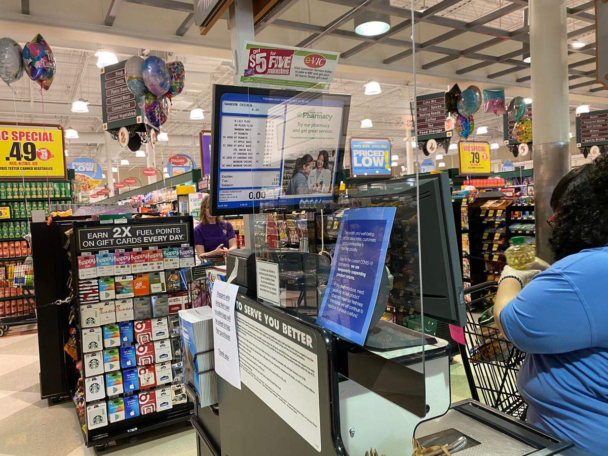 A newly installed plexiglass shield at a cash register at a Harris Teeter store on Falls of Neuse Road in Raleigh offers protection from COVID-19 coronavirus spread on March 28, 2020.