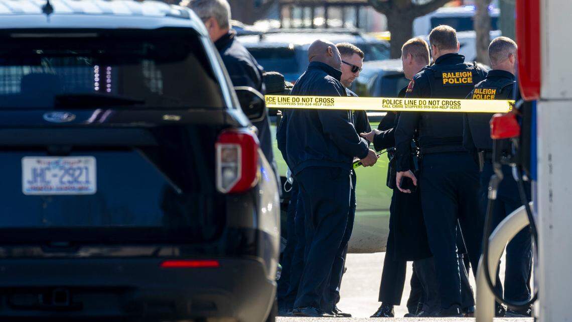 Raleigh Police investigate a possible shooting in N. Hills, adjacent to the Exxon station at the intersection of Lassiter Mill Road and Six Forks Road on Friday, January 17, 2025 in Raleigh, N.C.