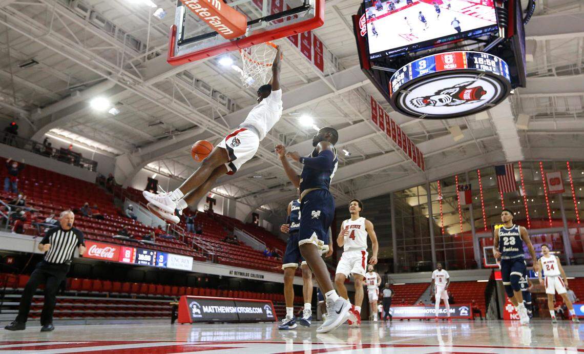 N.C. State’s Cam Hayes (3) slams in two during N.C. State’s 95-61 victory over Charleston Southern in the Wolfpack Invitational at Reynolds Coliseum in Raleigh, N.C., Wednesday, Nov. 25, 2020.