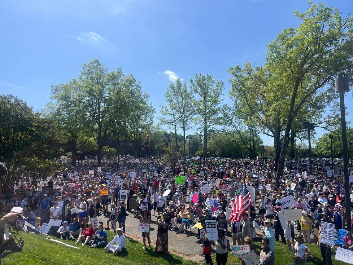 A crowd estimated to be in the thousands gathered outside the Mecklenburg County Social Services Department office in Charlotte Saturday as part of a nationwide set of “Hands Off!” protests.