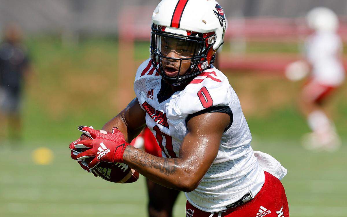 N.C. State running back Demie Sumo-Karngbaye (0) runs a drill during the Wolfpack’s first practice of fall camp in Raleigh, N.C., Wednesday, August 3, 2022.