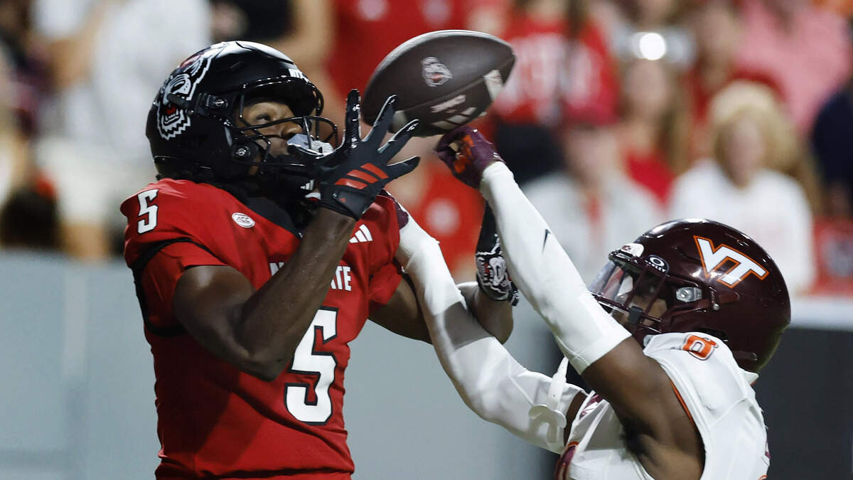 N.C. State wide receiver Noah Rogers (5) can’t pull in the reception while defended by Virginia Tech safety Christian Ellis (8) during the first half of N.C. State’s game against Virginia Tech at Carter-Finley Stadium in Raleigh, N.C., Saturday, Sept. 27, 2025.