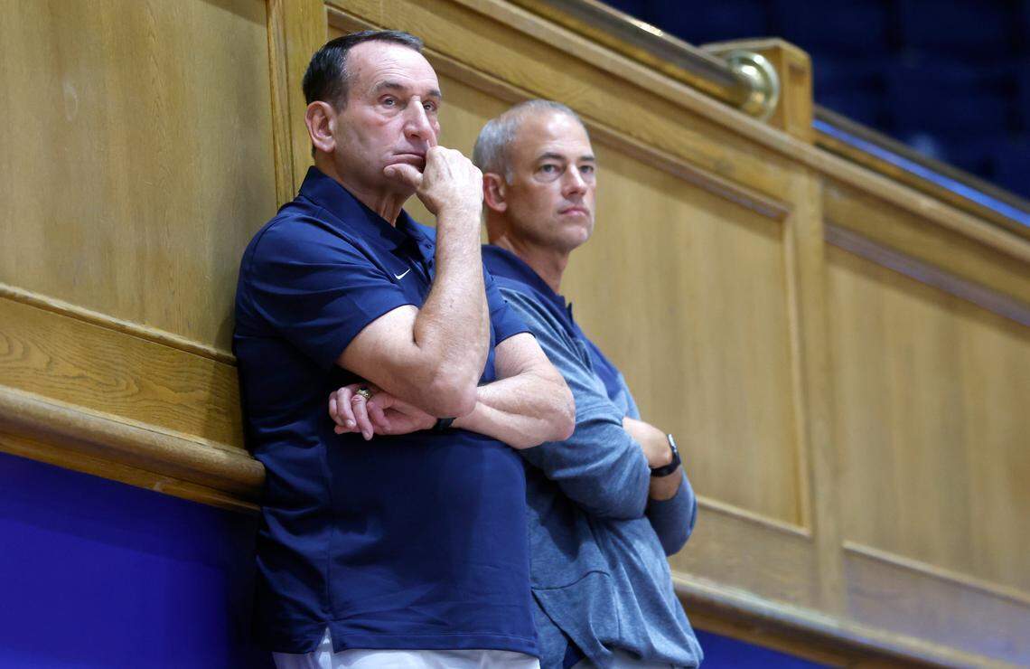 Former Duke head basketball coach Mike Krzyzewski and Mike Schrage, special assistant to the basketball head coach, watch Duke volleyball’s game against East Tennessee State University in the Duke Invitational at Cameron Indoor Stadium in Durham, N.C., Friday, Sept. 2, 2022.
