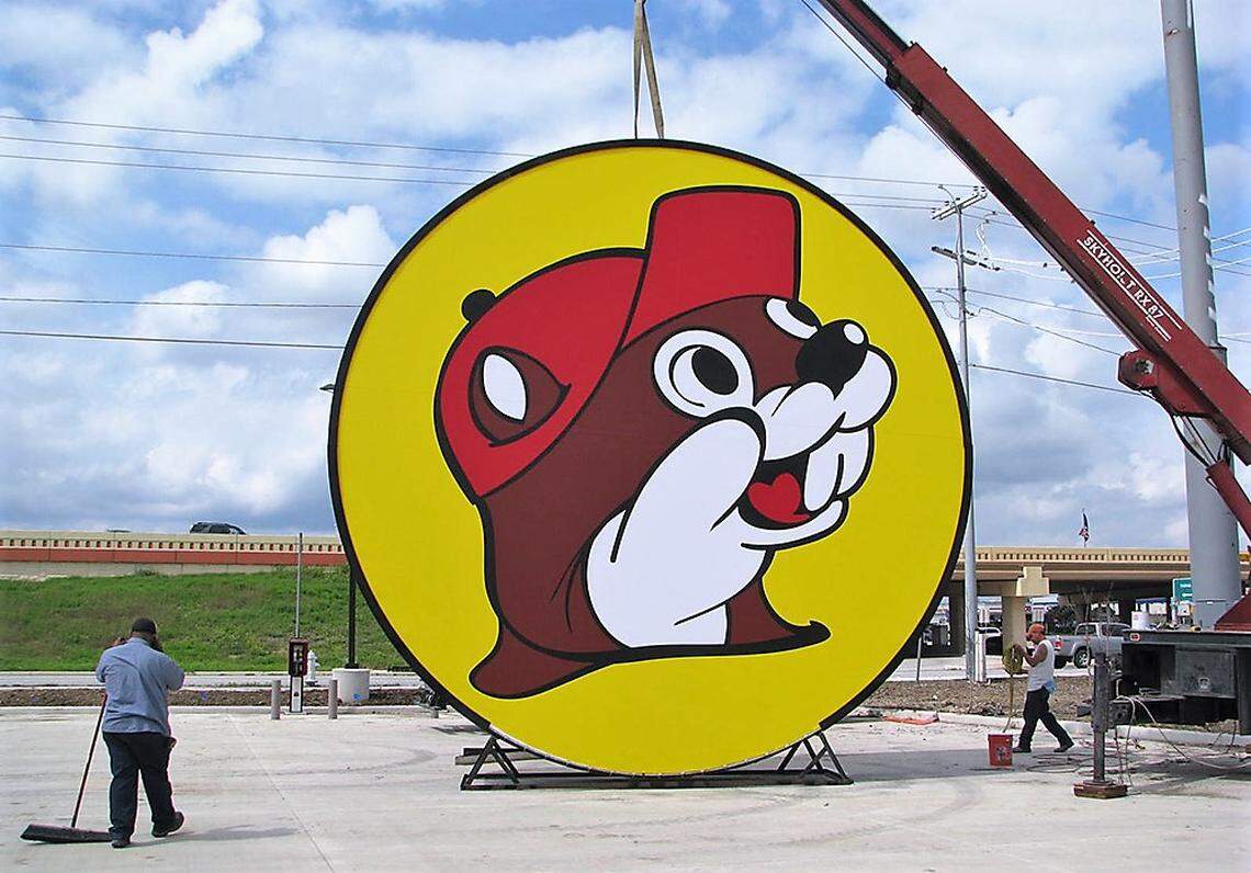 A crew raises a sign featuring Buc-ee the Beaver at the New Braunfels store in Texas. A similar 25-foot by 25-foot sign is planned for the Buc-ee’s store proposed along I-85/40 in Efland.