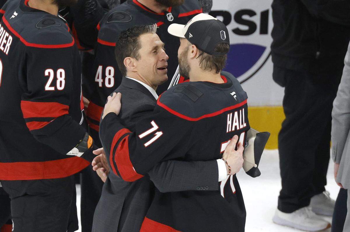 Carolina Hurricanes head coach Rod Brind'Amour celebrates with Taylor Hall (71) after the Hurricanes’ 6-1 victory over the Canadiens in game five of the Eastern Conference Finals at the Lenovo Center Friday, May 29, 2026.
