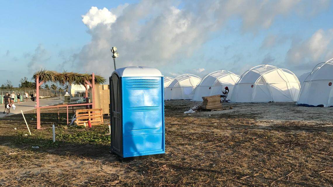 This photo provided by Jake Strang shows tents and a portable toilet set up for attendees for the Fyre Festival, Friday, April 28, 2017 in the Exuma islands, Bahamas. Organizers of the much-hyped music festival in the Bahamas canceled the weekend event at the last minute Friday after many people had already arrived and spent thousands of dollars on tickets and travel. A statement cited “circumstances out of our control,” for their inability to prepare the “physical infrastructure” for the event in the largely undeveloped Exumas. (Jake Strang via AP)