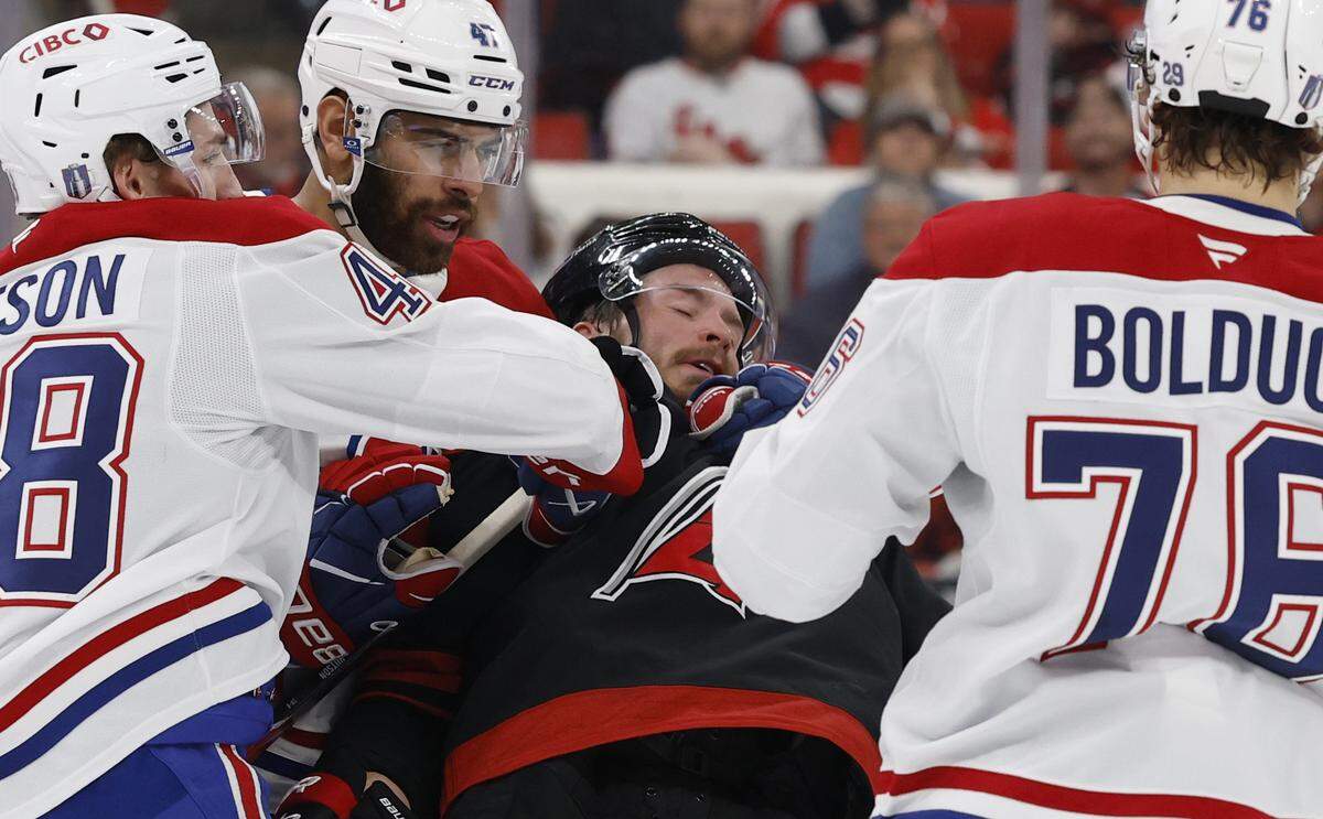 A penalty is called on Montréal's Jayden Struble (47) as he pulls down Carolina's Andrei Svechnikov (37) during the first period of the Hurricanes’ game against the Canadiens in game two of the Eastern Conference Finals at the Lenovo Center in Raleigh, N.C., Saturday, May 23, 2026.