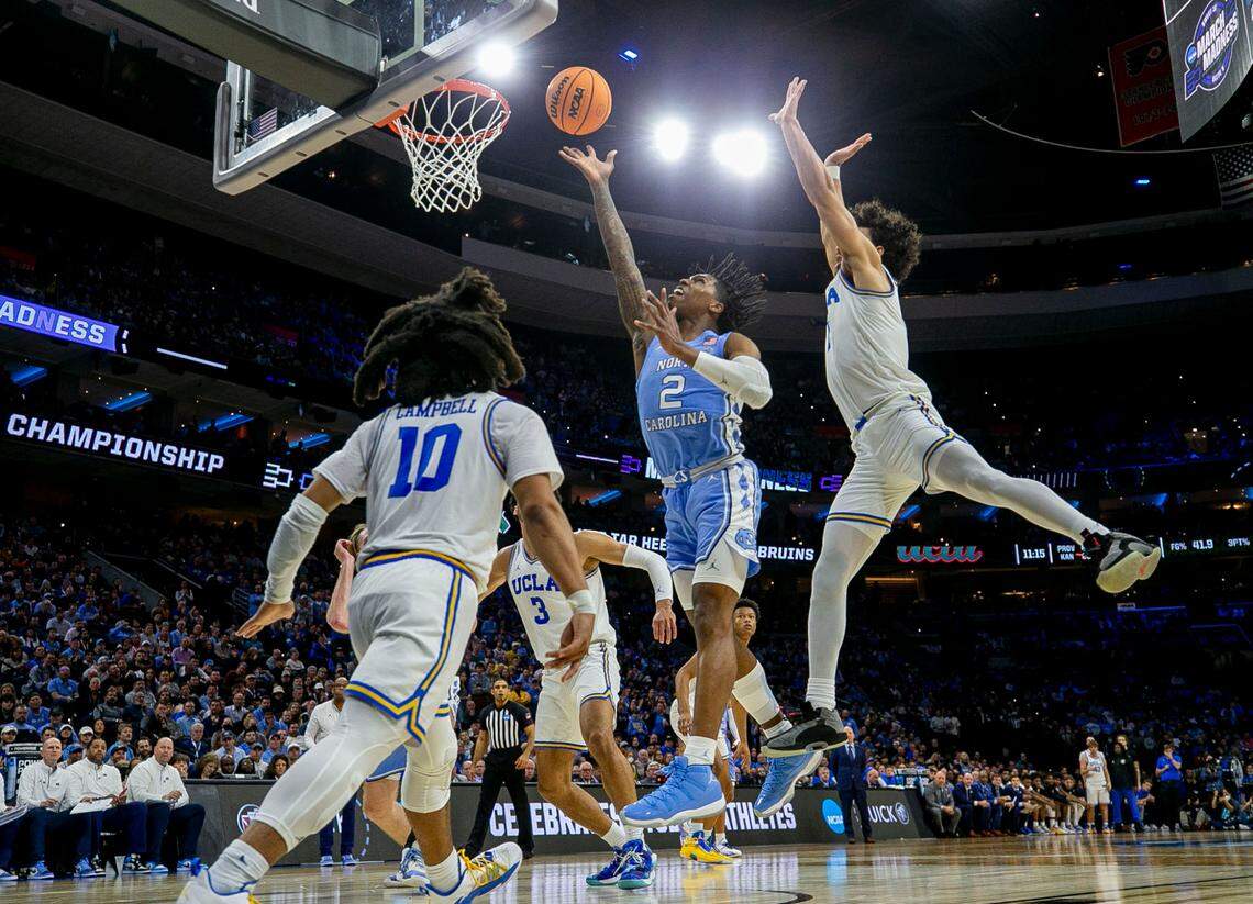 North Carolina’s Caleb Love (2) breaks through UCLA defense for two of his game high 30 points during the second half on Friday, March 25, 2022 during the NCAA East Regional semi-final at Wells Fargo Center in Philadelphia, Pa.