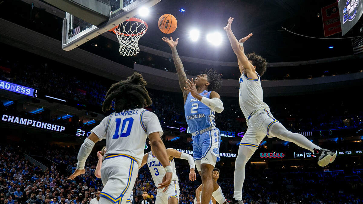 North Carolina’s Caleb Love (2) breaks through UCLA defense for two of his game high 30 points during the second half on Friday, March 25, 2022 during the NCAA East Regional semi-final at Wells Fargo Center in Philadelphia, Pa.