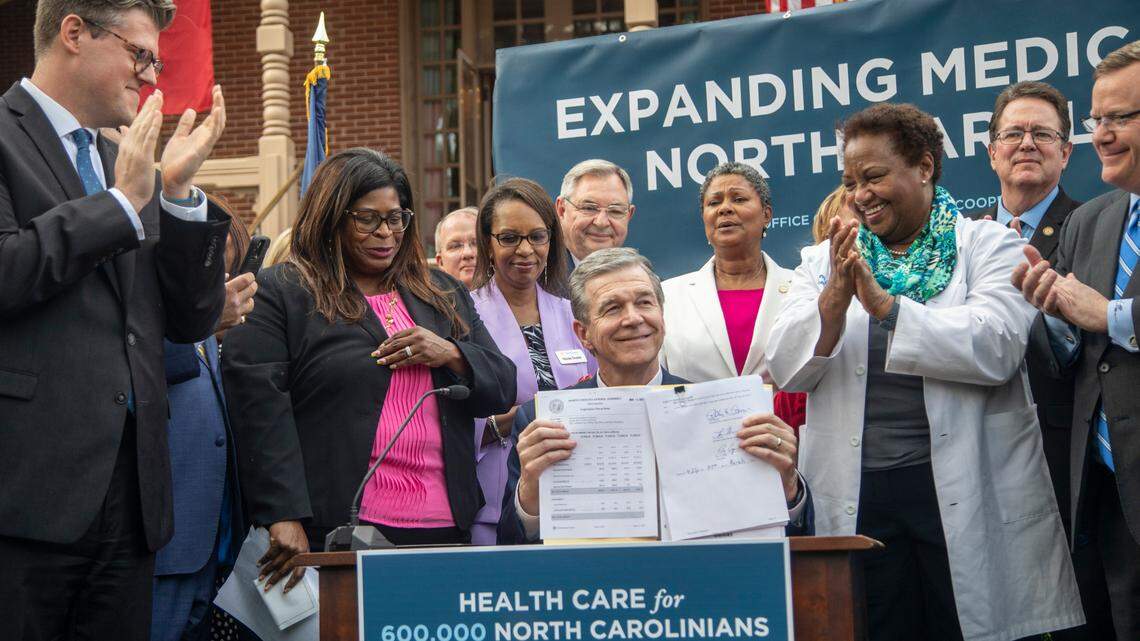 Gov. Roy Cooper signs NC Medicaid expansion into law. But it comes with an asterisk.