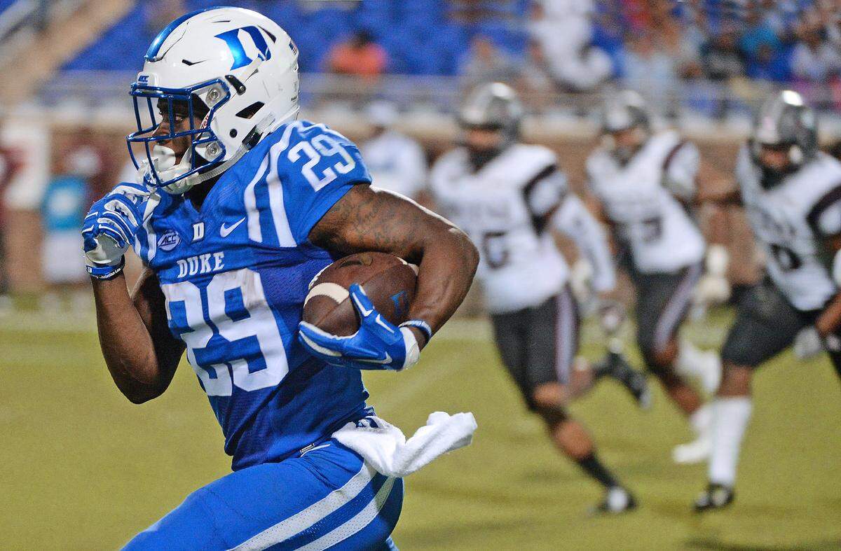Duke running back Shaun Wilson (29) outraces the NCCU defense as he scores a 90 yard touchdown in the third quarter as the Blue Devils defeated NCCU 55-0 at Wallace Wade Stadium in Durham, N.C. Saturday, September 12, 2015.