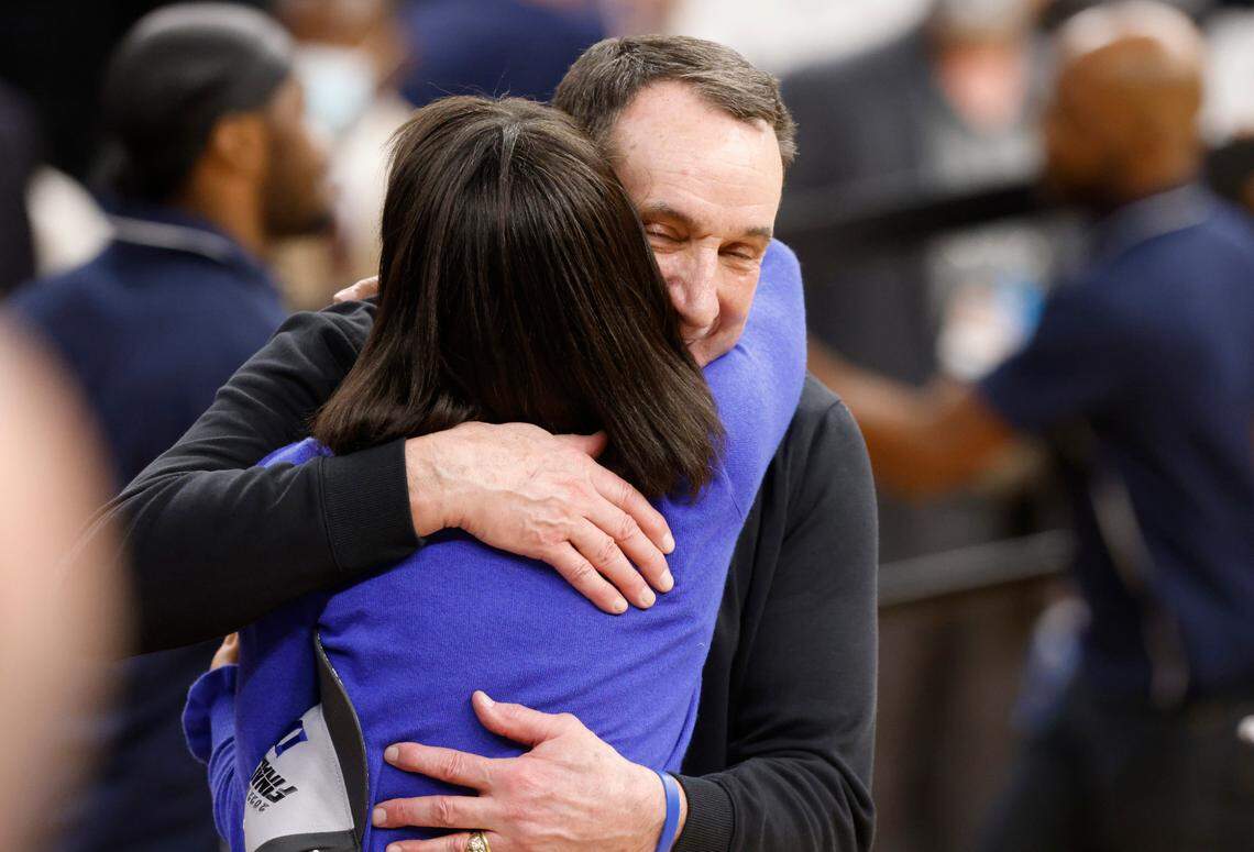 Duke head coach Mike Krzyzewski and Duke athletic director Nina King hug after Duke’s 78-69 victory over Arkansas in the NCAA Tournament West Regional finals at the Chase Center in San Francisco, Calif., Saturday, March 26, 2022.