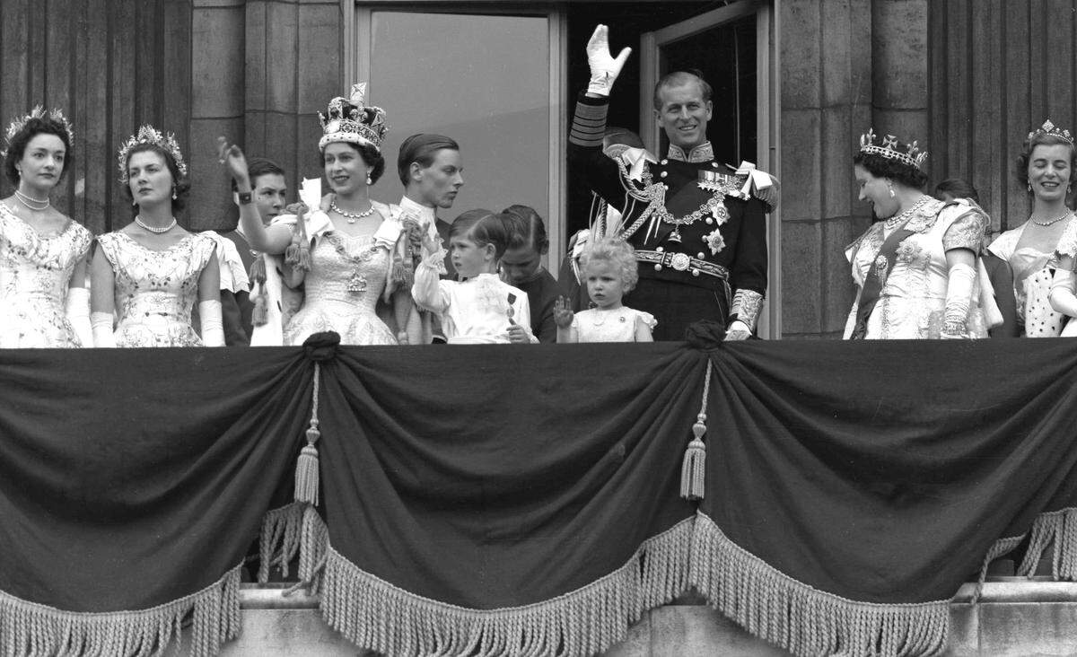 Britain’s Queen Elizabeth II and Prince Philip, Duke of Edinburgh, gather with other members of the British Royal Family to greet supporters from the balcony at Buckingham Palace, following her coronation which took place in Westminster Abbey. London, June. 2, 1953.