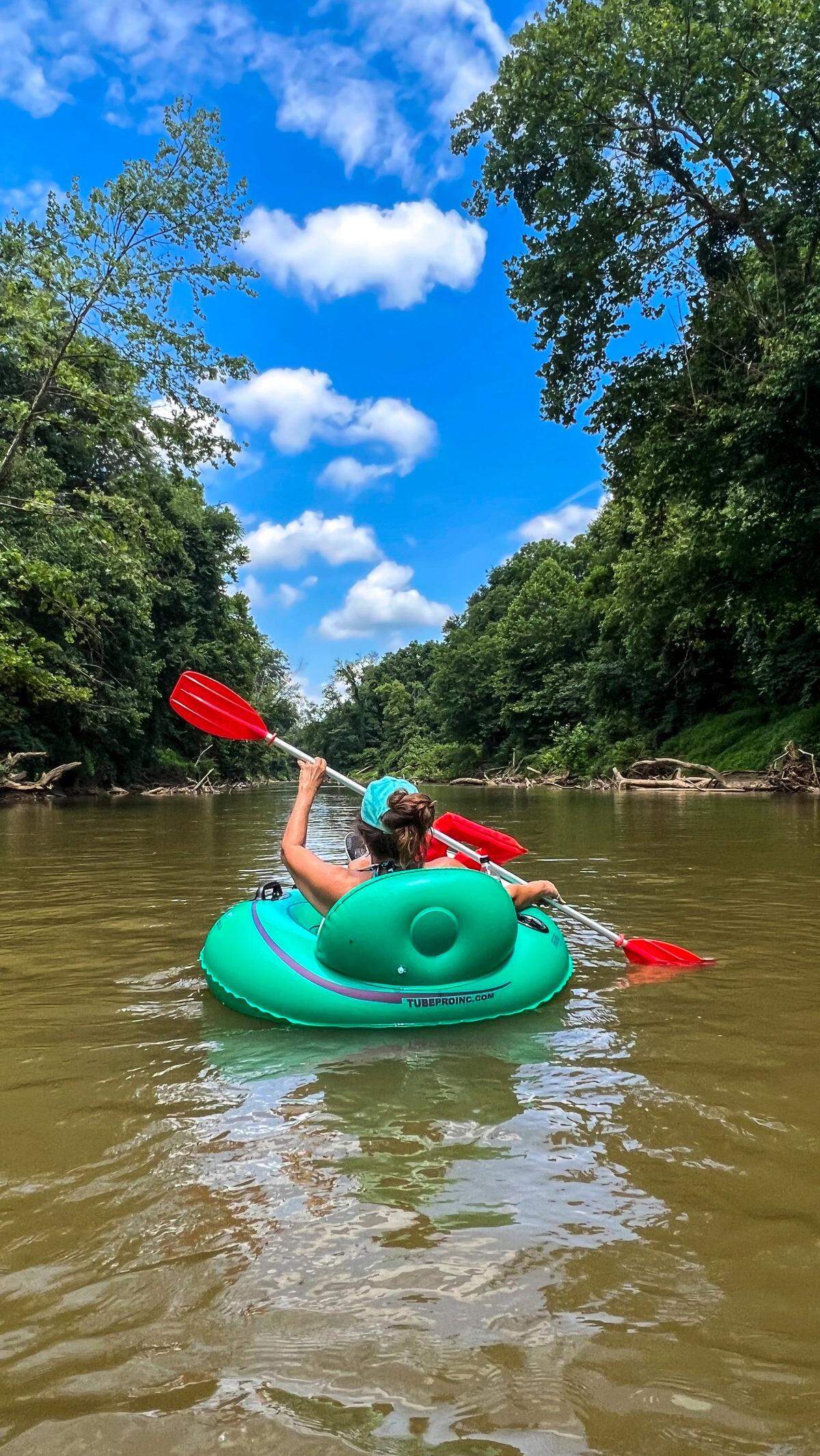 News & Observer reporter Martha Quillin floats down the Dan River near Madison in July 2022.
