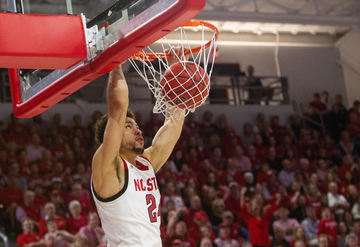 N.C. State’s Devon Daniels (24) slams against Harvard during the first half of the second round of the NIT at Reynolds Coliseum Sunday, March 24, 2019.
