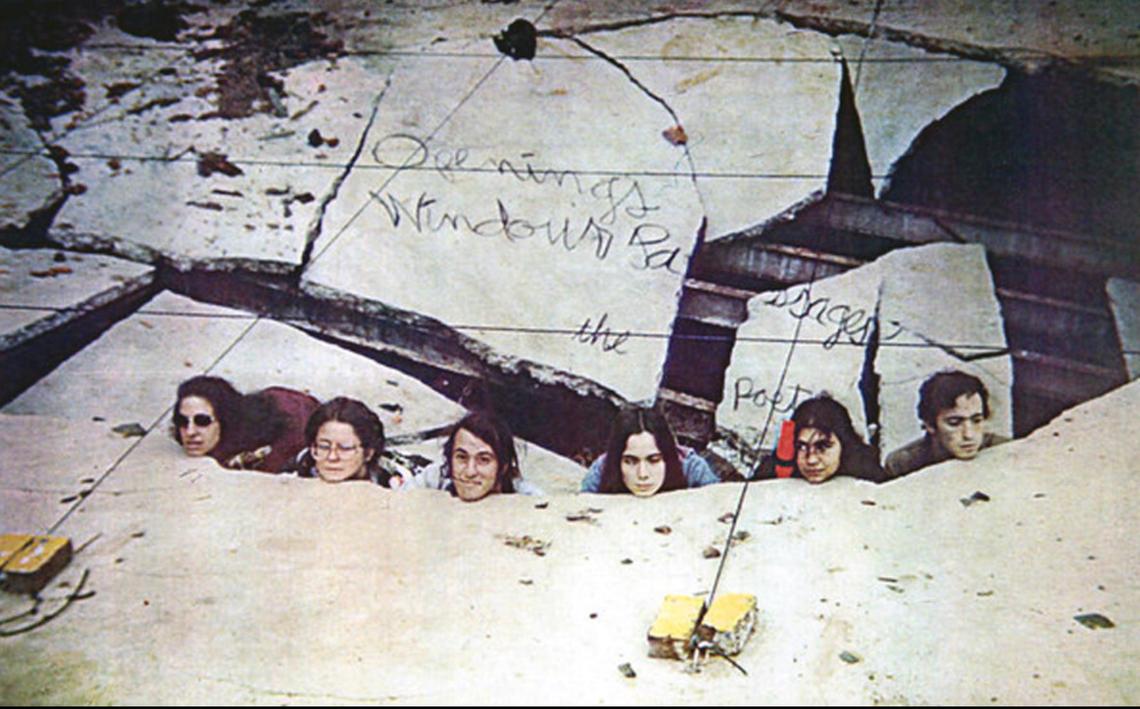 From left: Julia Demarre, Allyn Stewart, Avi Wenger, Katherine Myers, Ronnie Ruedrich and David Sedaris, the cast of “Openings Windows and Passages,” peer up from the floor of a downtown Raleigh warehouse in this promo shot by in 1979.
