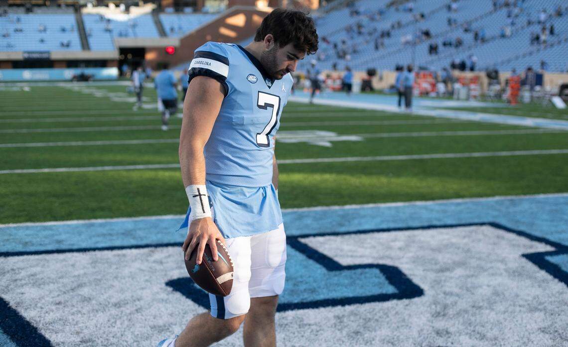 North Carolina quarterback Sam Howell (7) leaves the field with the game ball after a record setting performance against Wake Forest. Howell completed 32 of 45 passes for 550 yards and 6 touchdowns in the Tar Heels; 59-53 victory. 