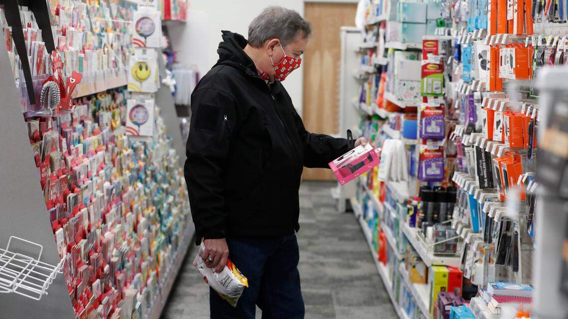 Larry Loucks shops at a CVS store in downtown Raleigh in February 2021. As the pandemic drags on, inflation has set in and Americans are paying higher prices for everything from milk to gas to cars. in. Economists say higher prices will likely last well into 2022.