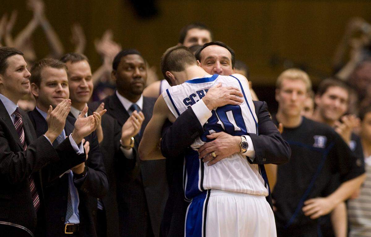 Duke senior Jon Scheyer gets a hug from coach Mike Krzyzewski after scoring 20 points in Duke’s 82-50 win in 2010. PHOTOS BY CHUCK LIDDY - cliddy@newsobserver.com