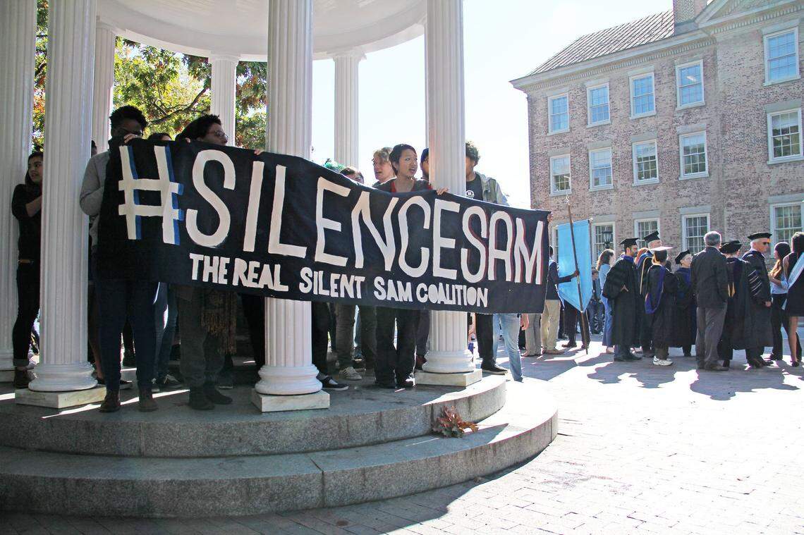 Members of The Real Silent Sam Coalition placed a black garment on the barrel of the statue’s gun on University Day on Monday, Oct. 12, 2015. The skirt symbolized the skirt that industrialist Julian Carr said at the statue’s 1913 dedication hung in shreds after he “horsewhipped a Negro wench” for insulting a Southern lady on the street.