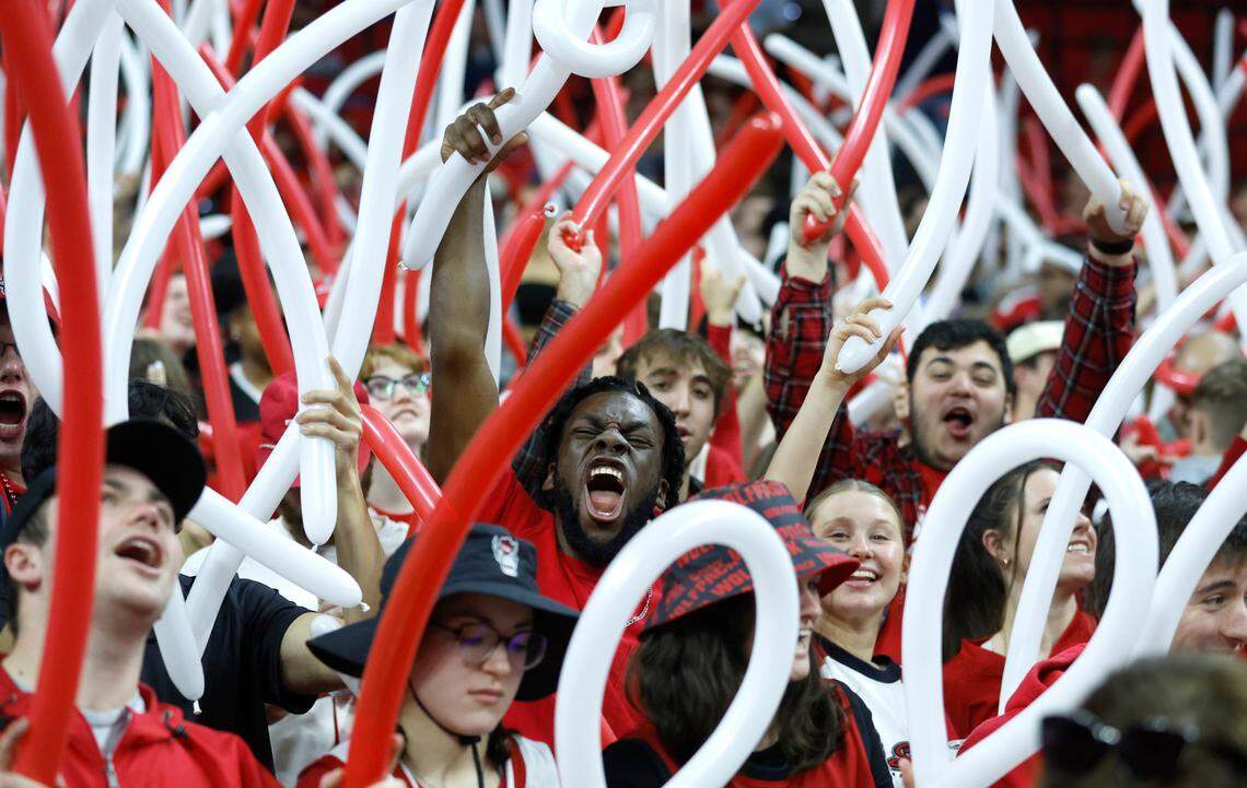 Fans cheer on the Wolfpack before N.C. State’s game against UNC at PNC Arena in Raleigh, N.C., Sunday, Feb. 19, 2023.