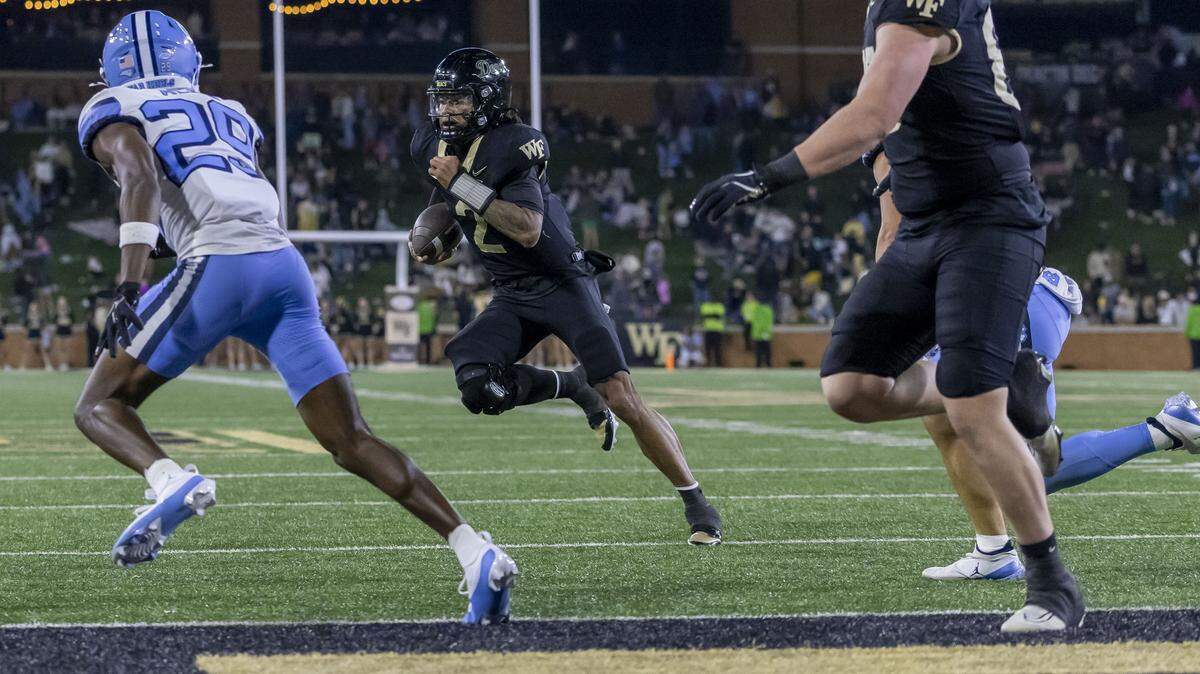 Wake Forest quarterback Robby Ashford (2) scores on a two-yard run with :27 second to play, to secure a 28-12 victory for the Demon Deacons over North Carolina on Saturday, November 15, 2025 at Allegacy Stadium in Winston-Salem, N.C.