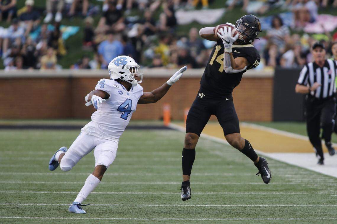 Wake Forest wide receiver Sage Surratt (14) had nine catches for 169 yards and a touchdown the one time he played against his brother, in 2019 in a 24-18 Wake Forest win over UNC.