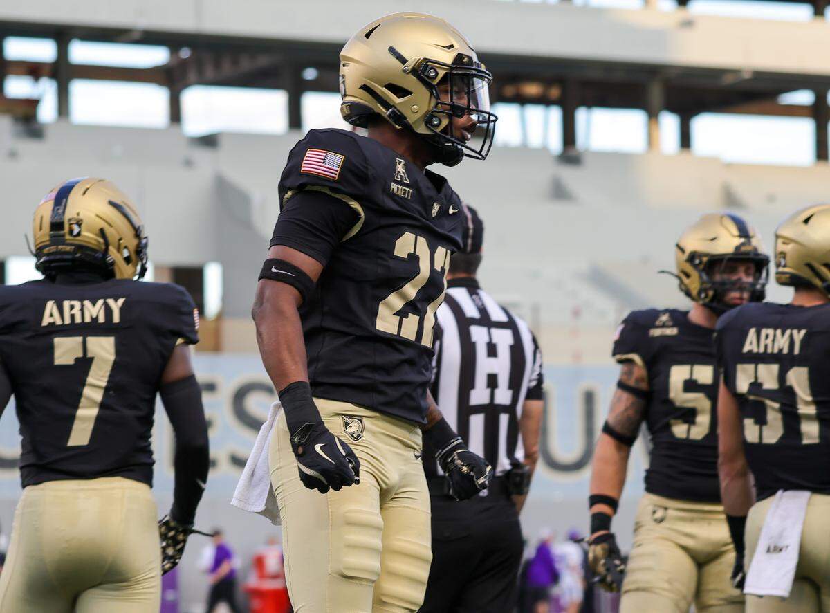 Army football’s Larry Pickett Jr. (22), a Raleigh native, returns to the huddle during a game against Tarleton State in August.