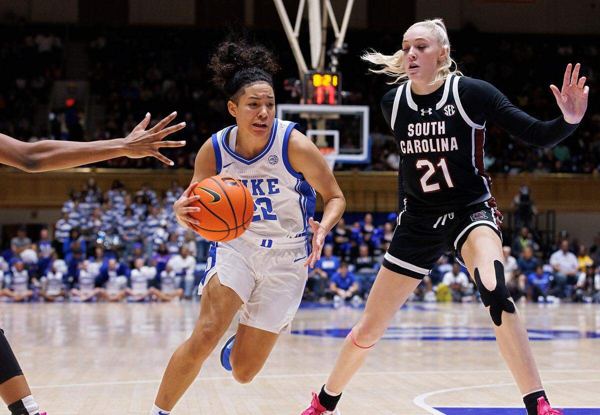 Duke’s Taina Mair pushes the ball past South Carolina’s Chloe Kitts during the second half of the Blue Devils’ 77-61 loss on Sunday, Dec. 3, 2023, at Cameron Indoor Stadium in Durham, N.C.