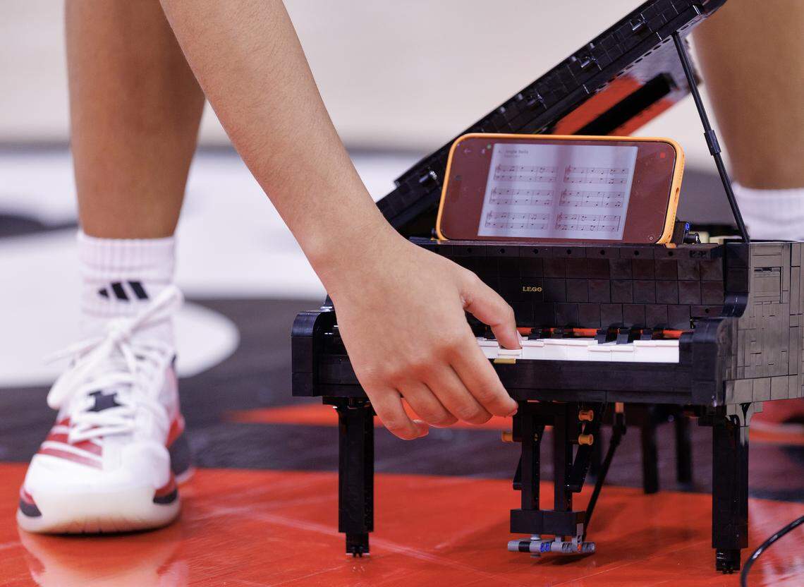 N.C. State sophomore guard Zamareya Jones, photographed at Reynolds Coliseum on Saturday, Jan. 3, 2026, demonstrates how she can play music on a Grand Piano Lego set she constructed. 