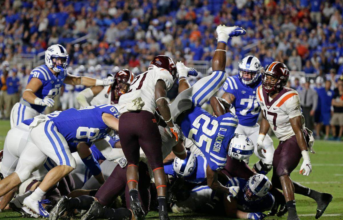 Duke’s Deon Jackson (25) scores a touchdown against Virginia Tech during the second half of an NCAA college football game in Durham, N.C., Saturday, Sept. 29, 2018. Virginia Tech won 31-14.