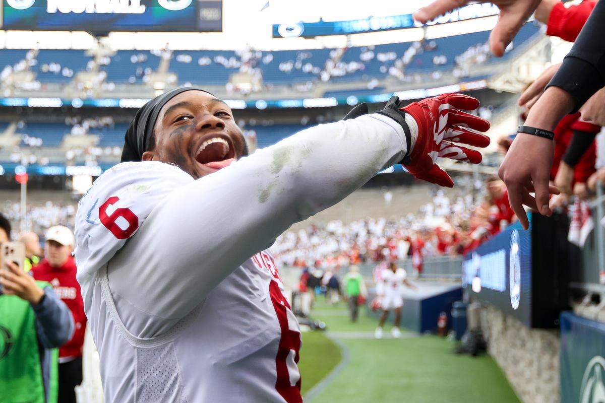 Mikail Kamara of the Indiana Hoosiers celebrates with fans after the game against the Penn State Nittany Lions at Beaver Stadium on Nov. 8, 2025 in State College, Pennsylvania. The Hoosiers beat the Nittany Lions, 27-24. 