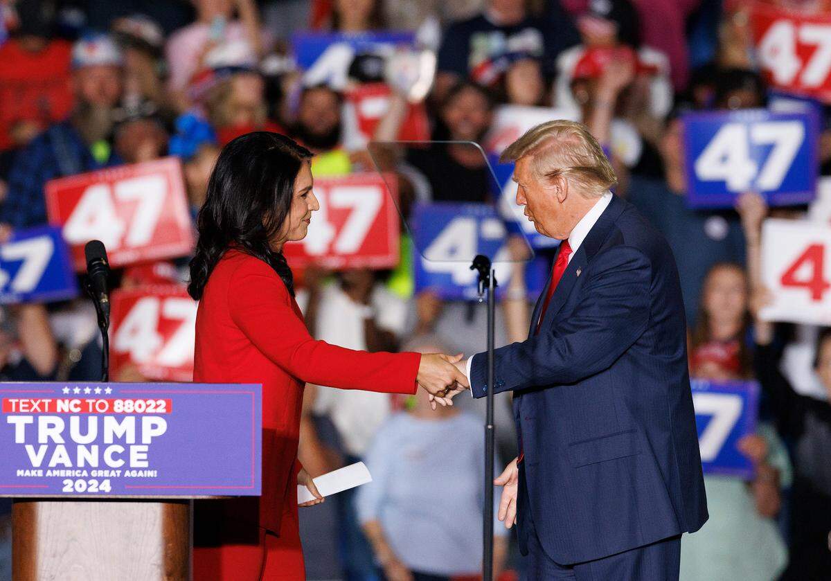 Tulsi Gabbard, a former Democratic congresswoman from Hawaii, with former President Donald Trump after announcing that she’s joining the Republican party during a rally at the Greensboro Coliseum Complex on Tuesday, Oct. 22, 2024, in Greensboro, N.C.
