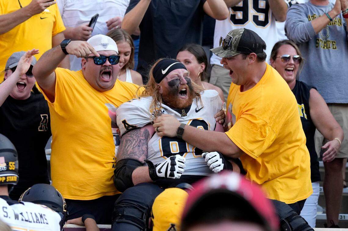 Appalachian State offensive lineman Bucky Williams (62) reacts with fans after the team’s 17-14 win over Texas A&M in an NCAA college football game Saturday, Sept. 10, 2022, in College Station, Texas.