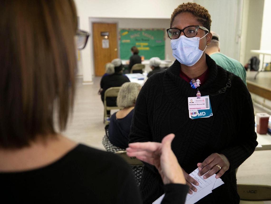 Dr. Rasheeda Monroe talks with a staff member during a vaccination clinic at Macedonia New Life Church on Rock Quarry Road on Saturday, February 6, 2021 in Raleigh, N.C.