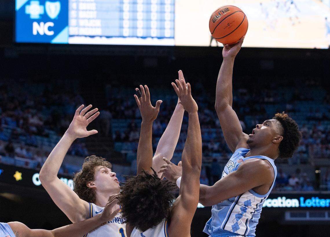 North Carolina’s Harrison Ingram shoots over UC Riverside’s Benjamin Griscti and Kyle Owens during the first half of the Tar Heels’ game on Friday, Nov. 17, 2023, at the Smith Center in Chapel Hill, N.C.