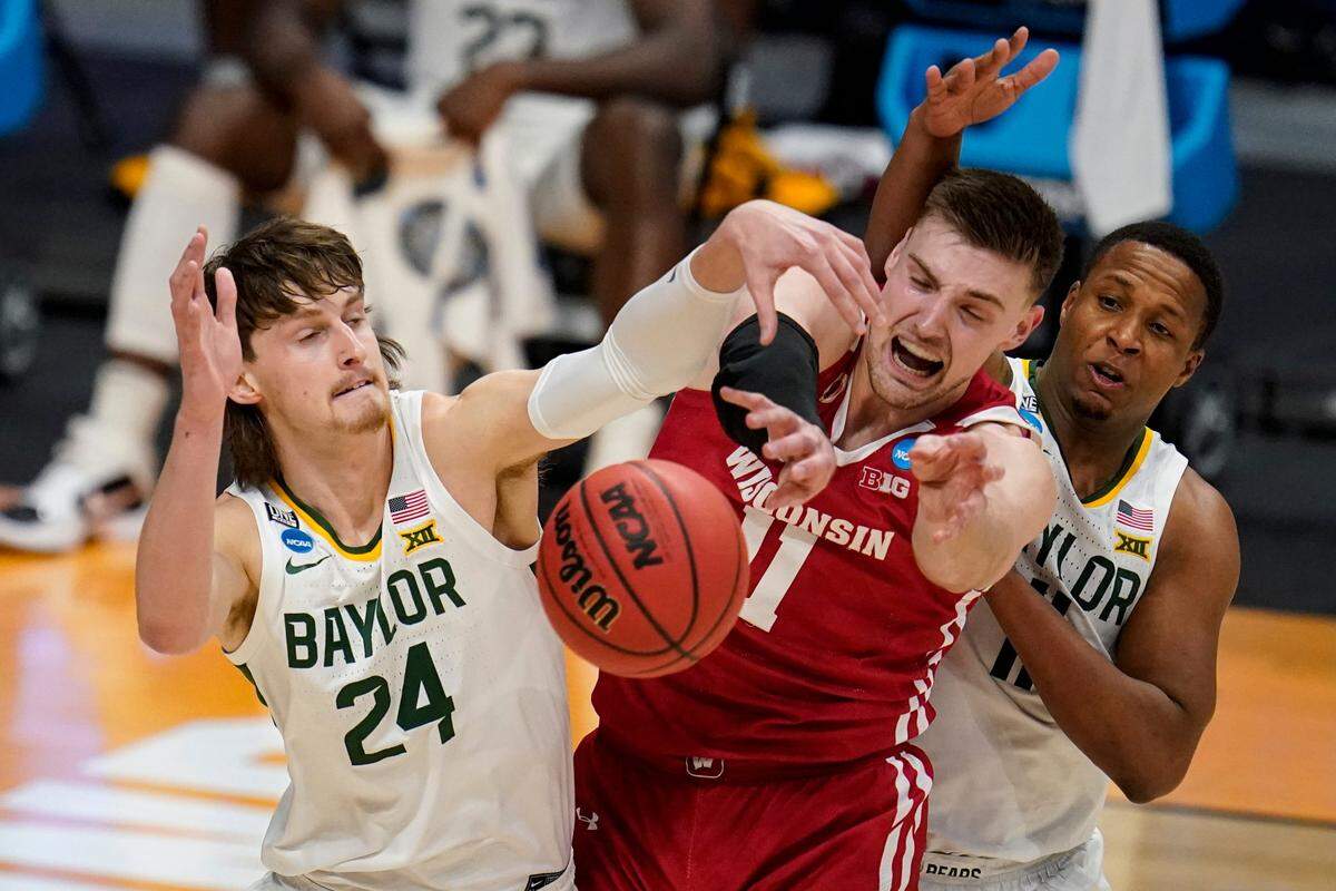 Baylor guard Matthew Mayer (24) blocks the shot of Wisconsin forward Micah Potter (11) in the first half of a second-round game in the NCAA men’s college basketball tournament at Hinkle Fieldhouse in Indianapolis, Sunday, March 21, 2021. 
