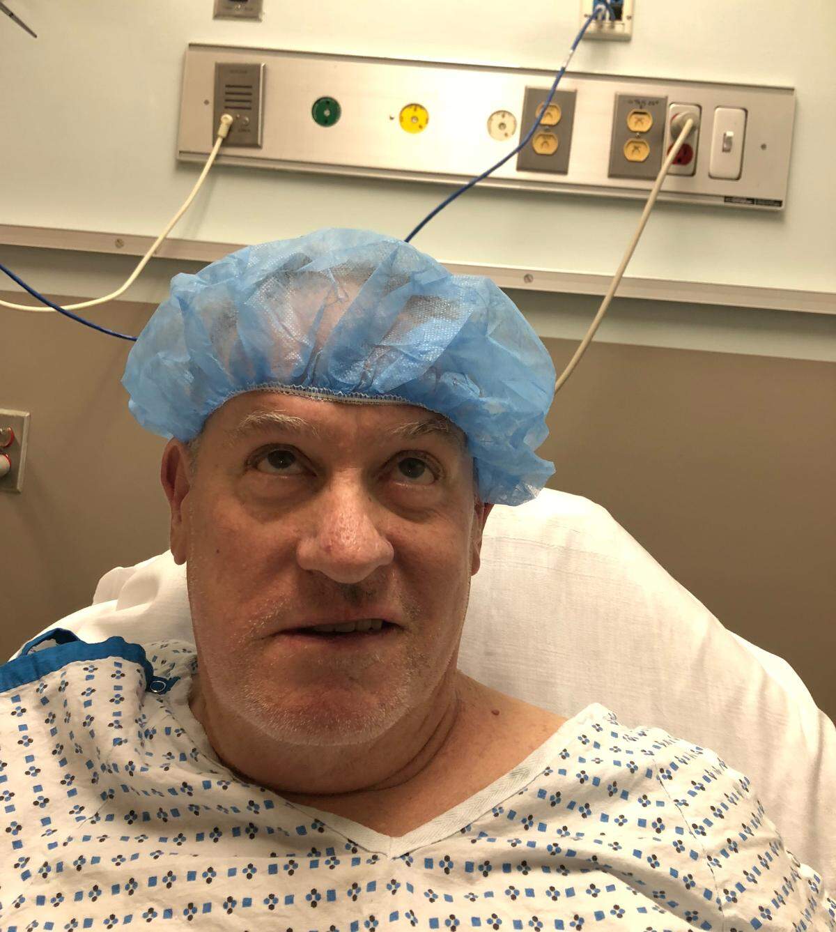 Sean Moynihan in a hospital room in an undated photo. Moynihan, who has been in and out of the hospital over the past 10 years, recently received a heart transplant from Sandor Szabo, who died in August after being punched in the face outside of New York City. Wake Forest assistant basketball coach Jamill Jones has been charged with misdemeanor assault in connection with Szabo’s death.