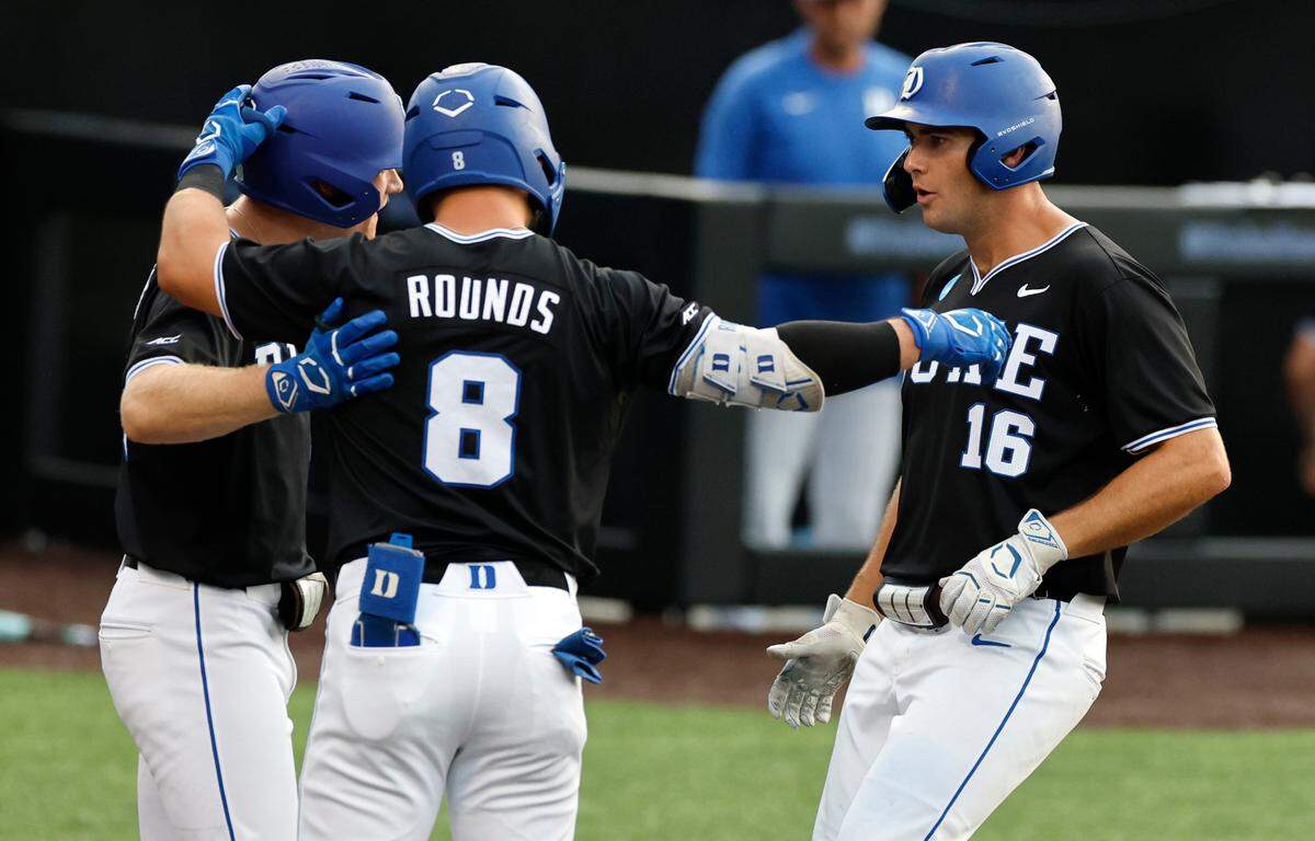 Duke’s Jake Hyde (16) celebrates with Tyler Albright (40) and Ben Rounds (8) after hitting a home run in the third inning during Duke’s game against Murray State in the third game of the Durham Super Regional at Jack Coombs Field in Durham, N.C., Monday, June 9, 2025.