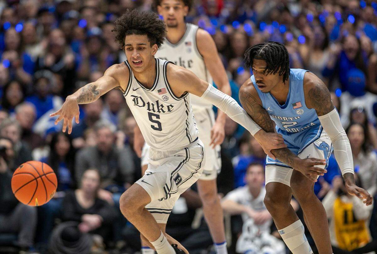 Duke’s Tyrese Proctor (5) makes a steal from North Carolina’s Caleb Love (2) during the first half on Saturday, February 4, 2023 at Cameron Indoor Stadium in Durham, N.C