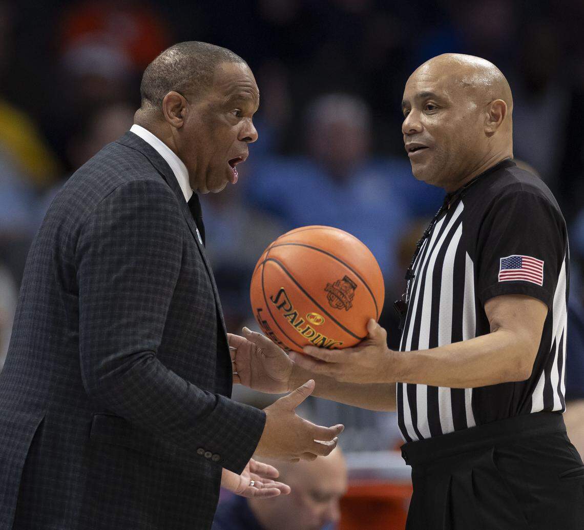 North Carolina coach Hubert Davis questions official Bill Covington in the second half against Clemson during the quarterfinals of the ACC Tournament at Spectrum Center in Charlotte, N.C. 