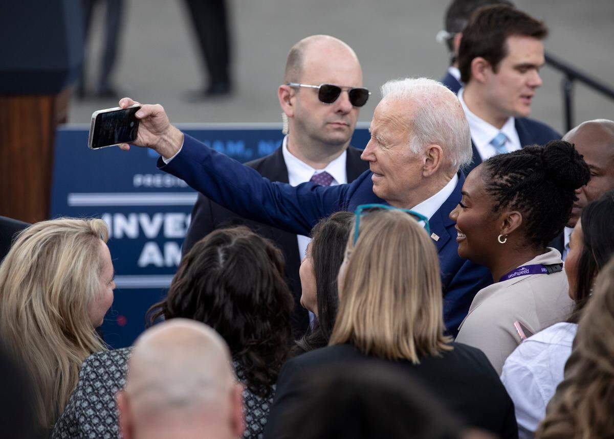 President Joe Biden takes a selfie after speaking at Wolfspeed on Tuesday, March 28, 2023, in Durham, N.C. 