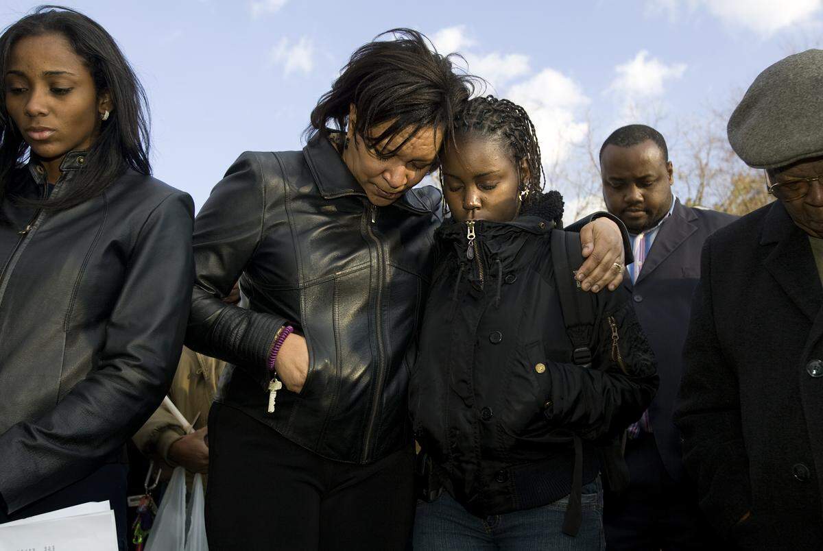 Family, community and St. Augustine College members gathered at the corner of Oakwood and N. Tarboro Street in 2009 for a vigil for Adarius Fowler, 16, who was shot near the corner. Two accused members of the Black Mob Gangstas, Demetrice Devine and Brandon Mangum, are on trial in federal court in Raleigh for murder and conspiracy.
