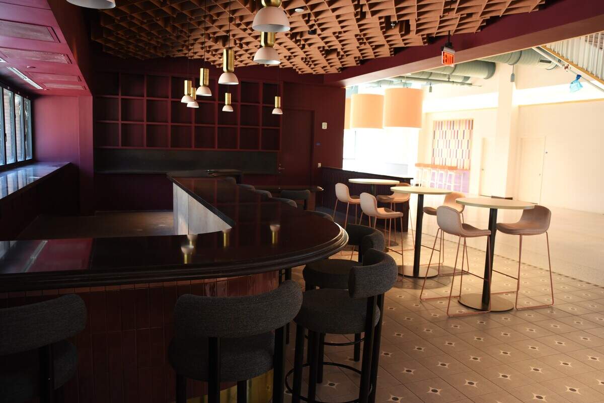 The new food hall at the NC State Fairgrounds features an indoor bar with a walk-up window on a large outdoor patio.