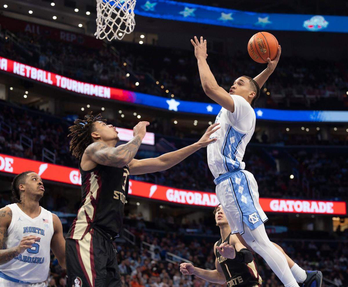 North Carolina’s Seth Trimble (7) soars to the basket against Florida State’s Cameron Corhen (3) in the second half during the quarterfinals of the ACC Men’s Basketball Tournament at Capitol One Arena on Wednesday, March 13, 2024 in Washington, D.C. Trimble scored 12 points.