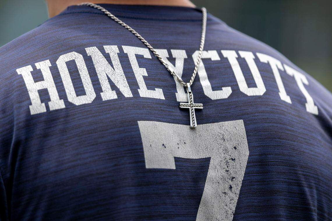 North Carolina’s Vance Honeycutt (7) wears his cross necklace across his back as he takes batting practice on Friday, June 10, 2022 at Boshamer Stadium in Chapel Hill, N.C.