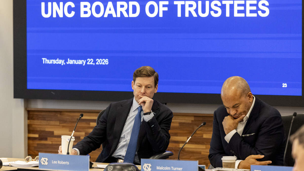 UNC-Chapel Hill Chancellor Lee Roberts, left, and UNC-Chapel Hill Board of Trustees Chair Malcolm Turner preside over the board’s open session meeting at the Spangler Center for Public Health in Chapel Hill on Thursday, Jan. 22, 2026. The board backed a surprise resolution Wednesday to cut $17 million in administrative costs, a proposal that relies in part on layoffs and further cuts to academic centers and institutes.