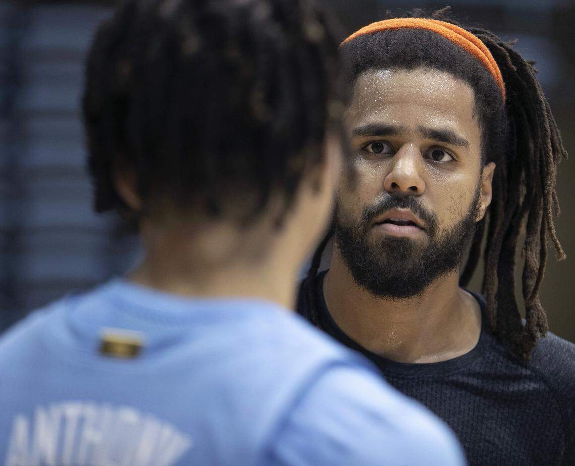 North Carolina’s Cole Anthony, left, meets recording artist J. Cole prior to the Tar Heels’ media day on Oct. 2, in Chapel Hill. Cole played basketball in high school and is known for his support of area basketball teams.