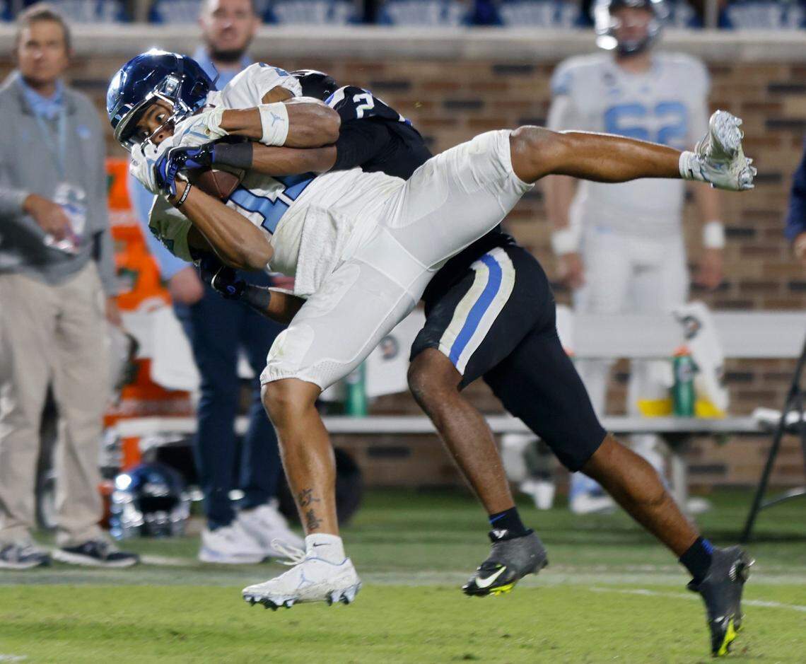 North Carolina Tar Heels wide receiver Josh Downs is tackled by Duke Blue Devils defensive back Jaylen Stinson during the second half of Saturday’s game at Wallace Wade Stadium in Durham, N.C.