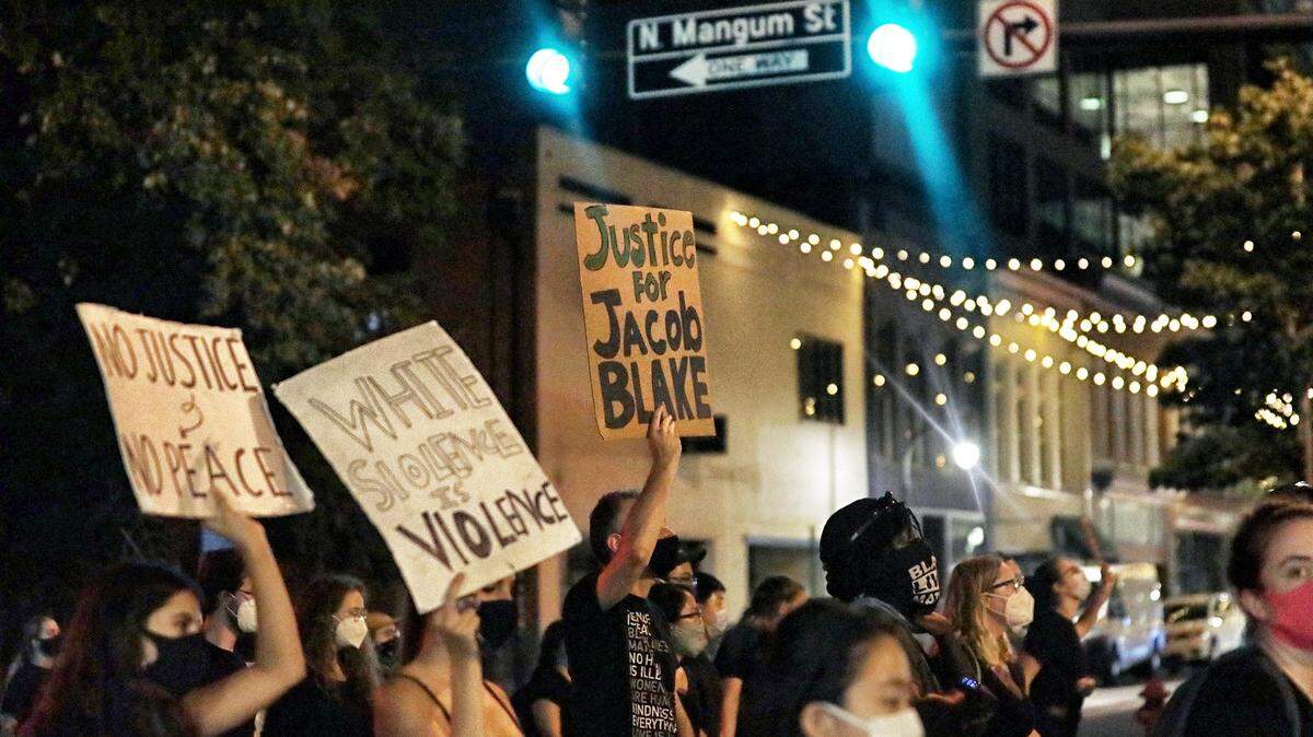 Protesters rally against systematic racism in downtown Durham Saturday night, Aug. 28, 2020.